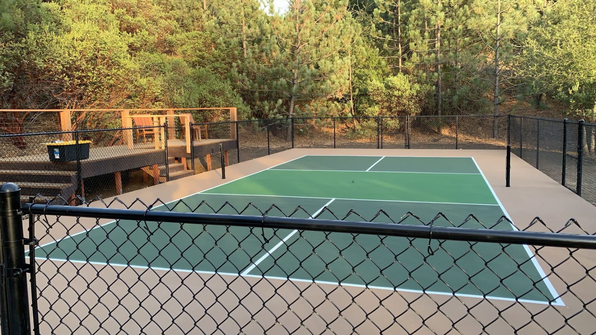 Finished pickleball court in dark green on tan